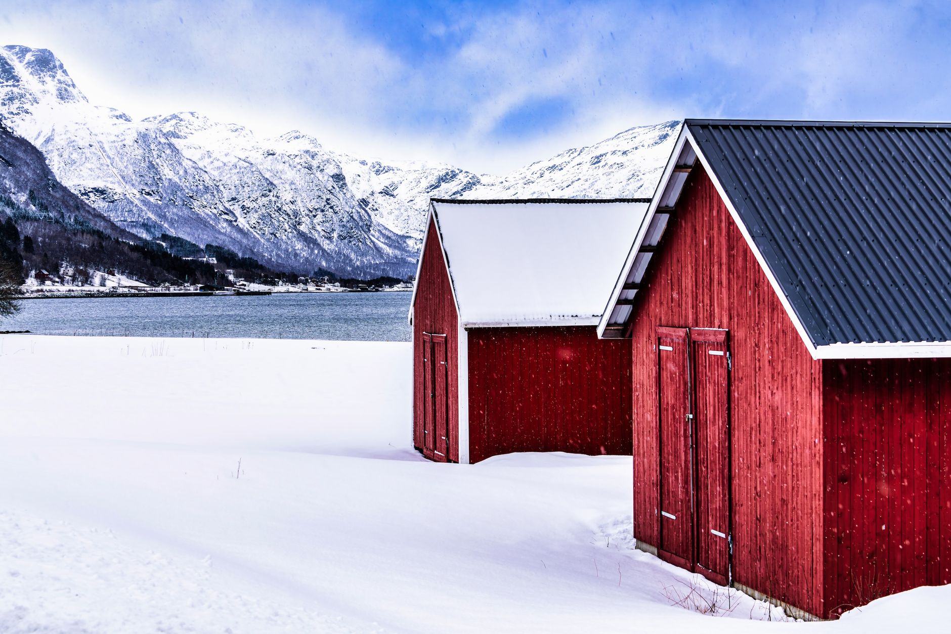 Scandinavian cabin overlooking silent fjord waters